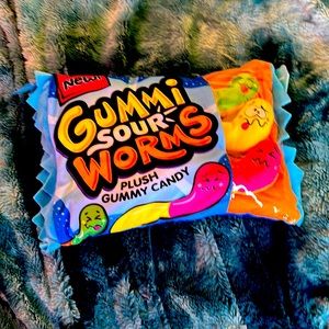 It’s a gummy sour worms pillow and you can take out the worms too